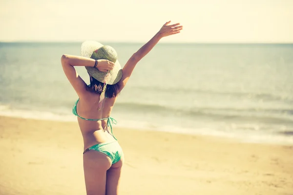 Summer beach fashion woman enjoying summer and sun.Concept of summer feeling,happiness.Fit and healthy summer body.
