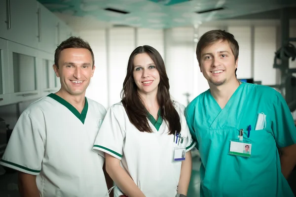 Young experienced doctors dentists standing along with nurse assistant.Team of doctors and nurse,good teamwork and positive work team spirit concept