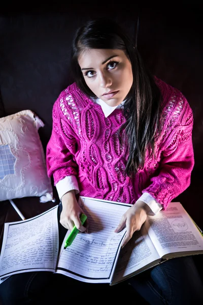 Tired student having a lot to read. Student girl with lot of books around. Student is studying. Study up.Attractive brunette woman student  studying