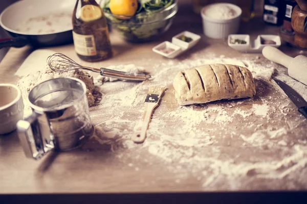 Cooking healthy balanced food.Carbohydrates.Whole grains.Dieting Concept.Healthy Lifestyle.Cooking food at home.Preparing dough for homemade bread on wooden table in the kitchen.Cutting dough.Portions