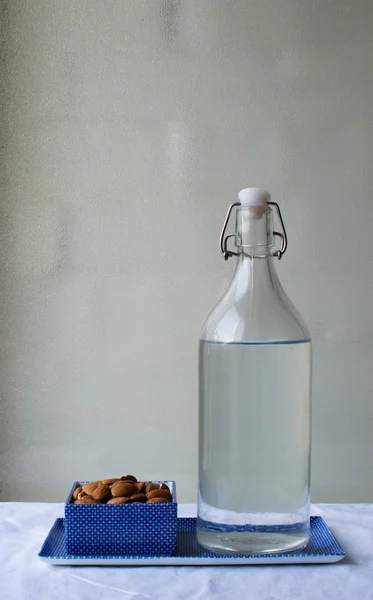 Almonds and glass bottle