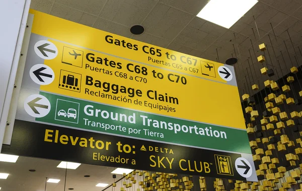 Direction signs at gate of JFK Airport New York  - NEW YORK, USA - APRIL 9, 2016