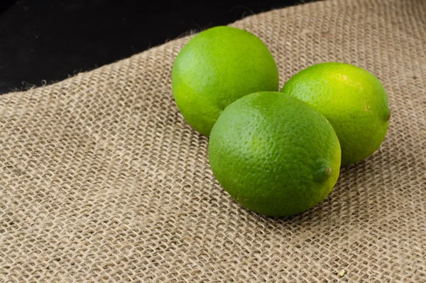 Limes on a jute table cloth