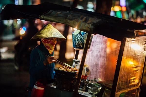 Street vendor with a cart on the street