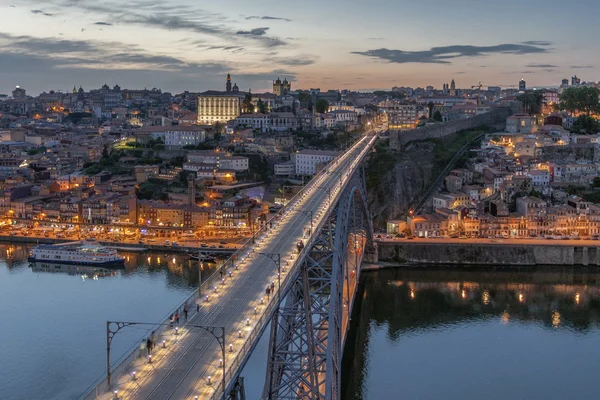 Night view of the historic city of Porto, Portugal with the Dom Luiz bridge.