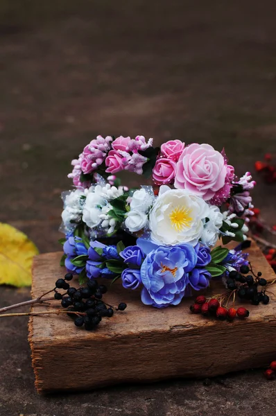 Hoop from flowers, wreath with colored flowers. Handmade flowers
