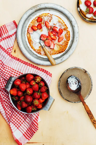 Strawberries and whipped cream  for dessert. Pancakes with  stra