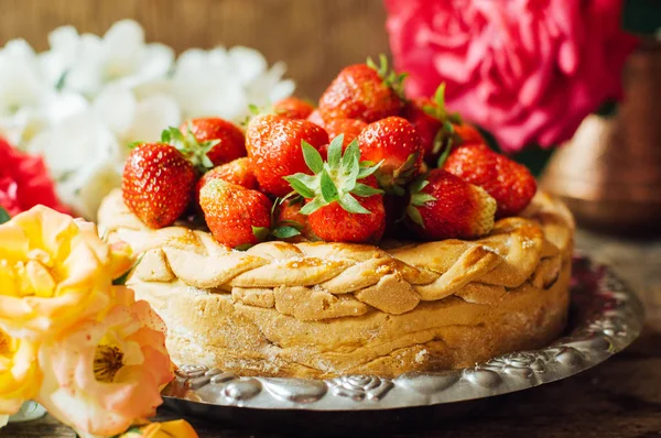 Homemade cherry and strawberry  pie on rustic background. Delici