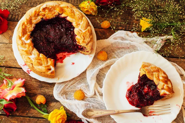 Tart with fresh berries.  Homemade  tart decorated with berries. Food: Cranberry and Raspberry upside down cake. a very natural and easy cake with olive oil and topped with caramelized raspberries