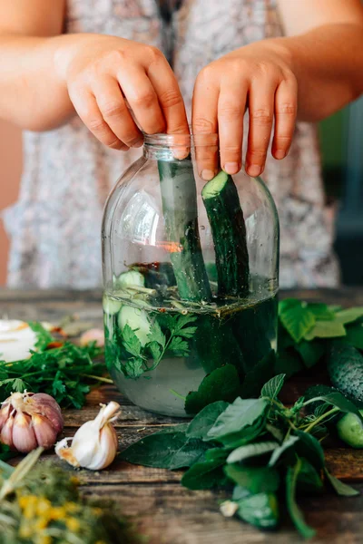 Fresh colorful salad in a mason jar. Mason Jar with pickle cucum