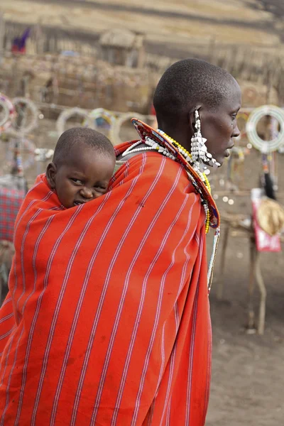 Portrait of Masai woman and baby with traditional beaded decorations, Tanzania