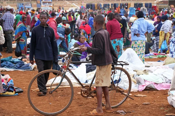 African boy with a bicycle at Karatu Iraqw Market, Tanzania.