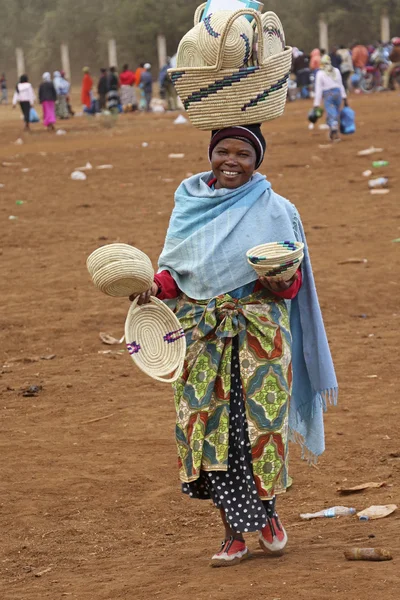 Portrait of African woman vendor on colourful clothes at Karatu Iraqw Market, Tanzania.