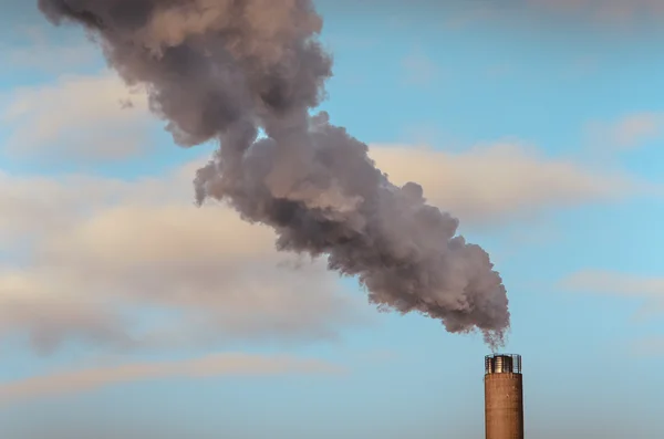 Smoke from high pipes, industry, environmental pollution in Helsinki, Finland