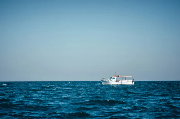 Lonely tourist boat in the Black Sea without people.