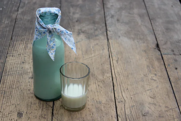 Bottle and a glass of organic milk