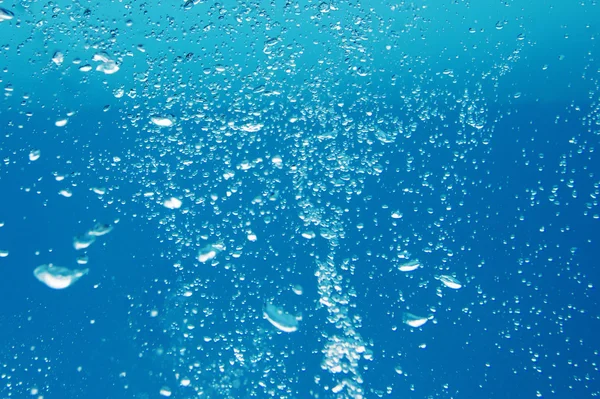 Air bubbles in the blue water