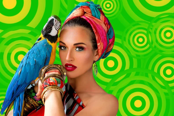 Woman in african style with ara parrot