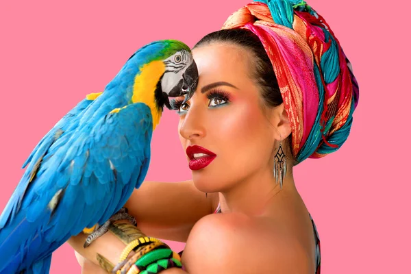 Woman in african style with ara parrot