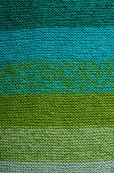 Background of knit green striped cloth