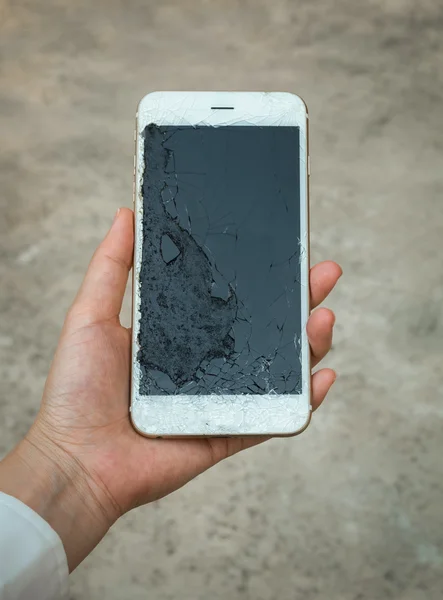 Crack Display Smartphone Screen Holding on Hand
