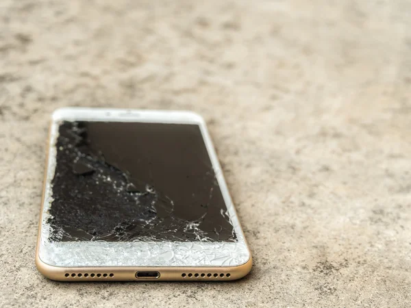 Close up of broken mobile phone drop
