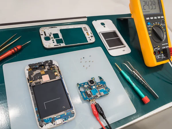 Repairing Smart Phone on Desk