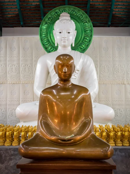 Monk statue and Buddha statue meditation