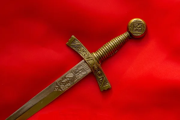 Souvenir dagger on a red background