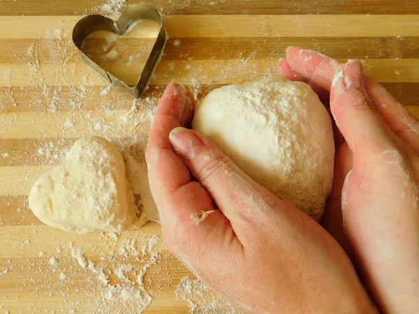 Yeast dough in baker`s hands