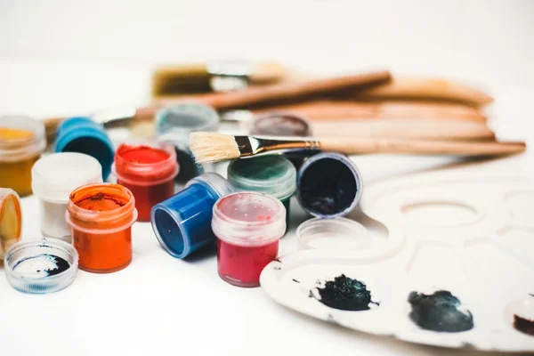 Paints, brushes and Palette of watercolor paints