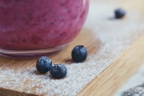 Delicious bilberry smoothie with fresh berries. Fresh yogurt wit