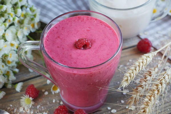 Delicious raspberry smoothie or milk shake with fresh berries. Fresh yogurt with raspberry. Healthy breakfast.