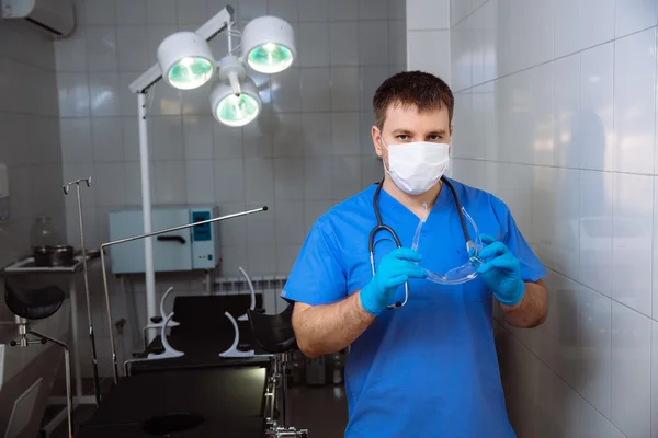 Doctor in operating room with medical tools. Concept of a hospital