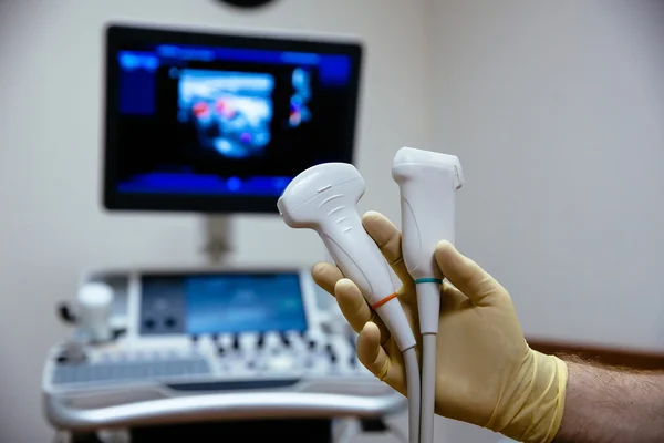 Ultrasonic investigation medical device for diagnostics in doctor hand. Hospital equipment