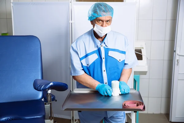 Doctor in operating room with medical tools. Concept of a hospital and healthy