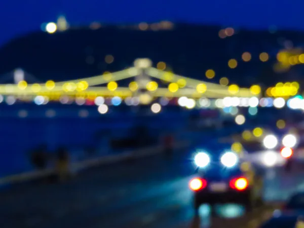 Blurred abstract background of the night city. Colorful bokeh from city lights and traffic