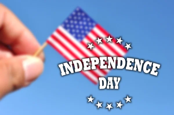 Independence Day usa banner with american flag in blue sky background