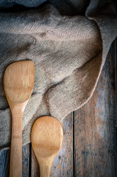 Wood kitchen utensils on wooden background