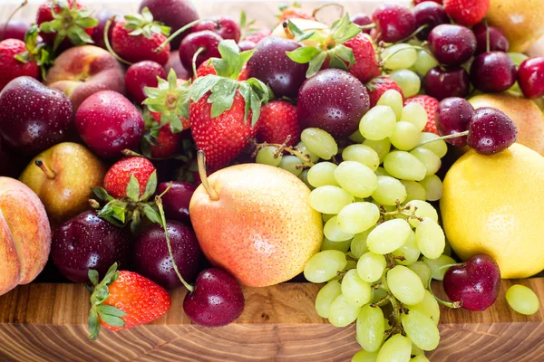 Fresh mixed fruits, berries background.Healthy eating.Love fruit, diet.