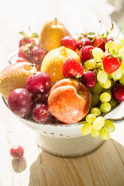 Fresh mixed fruits, berries in bowl. Love fruit, berry. Sunlight