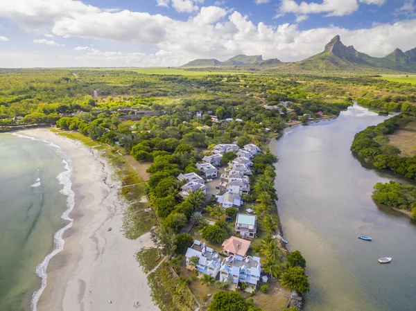 Top down aerial view of Black River Tamarin - Mauritius beach. Curepipe Black River Gorge National Park in background