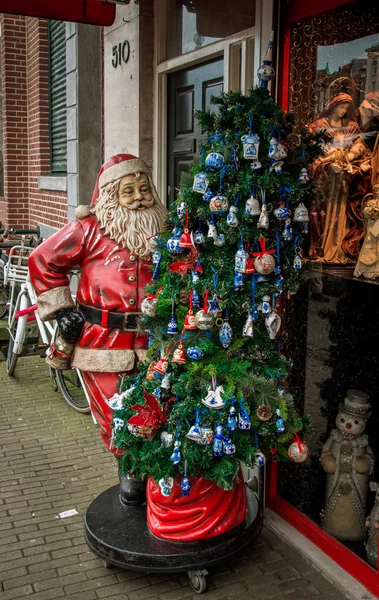 The figure of Santa Claus and Christmas tree