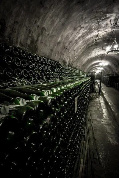 The rack with bottles of sparkling wine