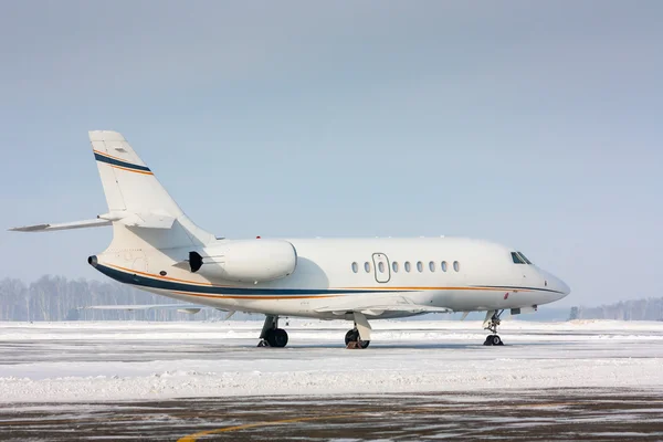 White private plane in a cold winter airport