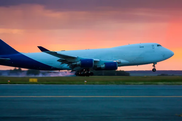 Landing widebody cargo aircraft early summer morning