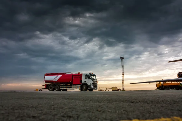 Aircraft fueler on the cloudy morning airport apron