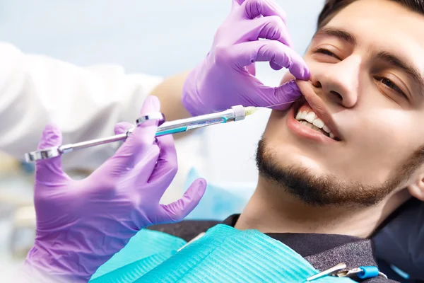 Portrait of male dentist. Dental care Concept.