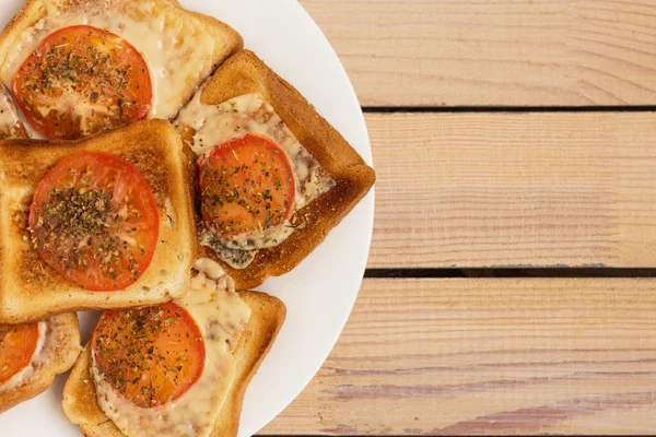 Toast with cheese tomato basil oregano