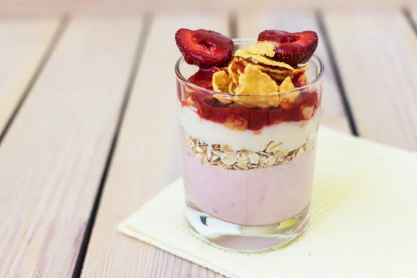 Yogurt with strawberries and corn flakes